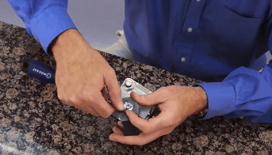 Person Replacing Solenoid in a Dust Collector Pulse Valve