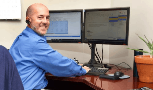 Dust Collector Customer Service Agent at Computer Desk